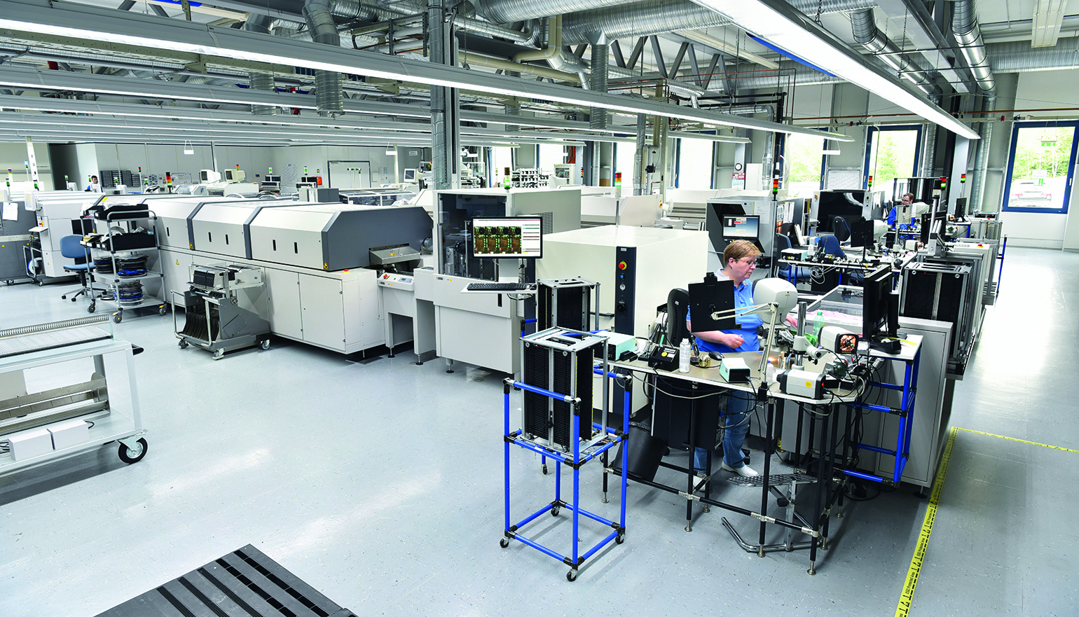 Modern industrial factory for the production of electronic components - machinery, interior and equipment of the production hall.